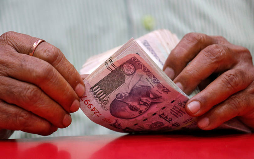 Rupee ends at record low as US growth worries spill over, spur outflows