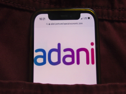 Adani Group cuts revenue growth target, capex